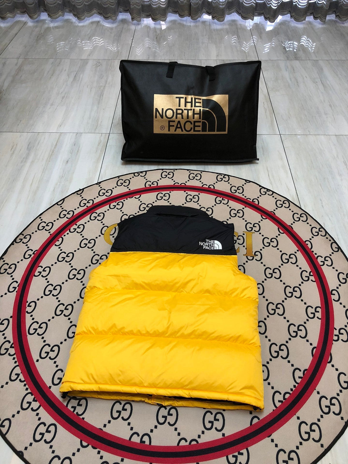 The North Face Puffer Vest in Yellow and Black with Stand Collar