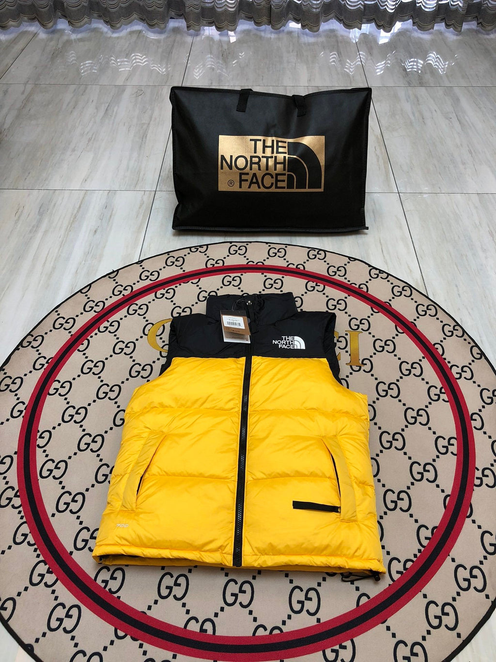 The North Face Puffer Vest in Yellow and Black with Stand Collar